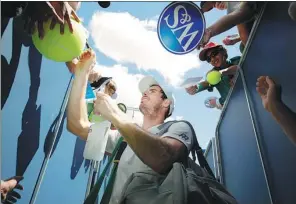  ?? ANDY LYONS / AGENCE FRANCE PRESSE ?? Olympic gold medalist Andy Murray signs autographs after practice ahead of Monday’s start of the US Open in New York.