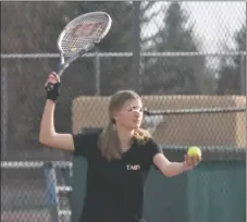  ?? ?? Anabelle Caldwell waits for the wind to stop blowing before she serves on Monday (April 18).