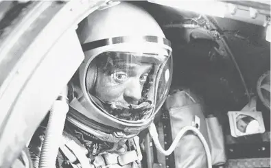  ?? AP ?? Mercury astronaut Alan Shepard sits in his Freedom 7 capsule May 5, 1961, at Cape Canaveral. He became the first American and the second person in space after the Soviet Union launched cosmonaut Yuri Gagarin three weeks earlier. Shepard walked on the moon in 1971.