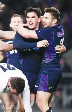  ?? PICTURE: Getty Images ?? What a comeback: Scotland’s Sam Johnson celebrates with his teammates after scoring their sixth try