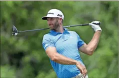  ?? David J. Phillip / The Associated Press ?? Dustin Johnson hits a drive on the 12th hole during a practice round for the U.S. Open golf tournament Wednesday at Erin Hills in Erin, Wis.