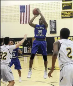  ?? GREGG SLABODA — TRENTONIAN PHOTO ?? Trenton Catholic Academy’s Rodrique Massenat (20) takes a shot Wednesday against Bordentown.