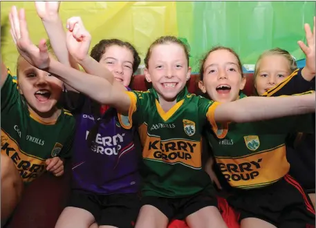  ??  ?? Fossa GAA junior members cheering Kerry in the All Ireland Minor final from the Fossa GAA Clubhouse on Sunday. Photo by Michelle Cooper Galvin