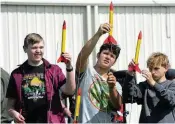  ?? STAFF MARSHALL GORBY / ?? Xenia Community STE(A)M Academy freshman students (from left) Tyler Egli, Onyx Heathco and Samuel Brown prepare to launch their rockets Friday.