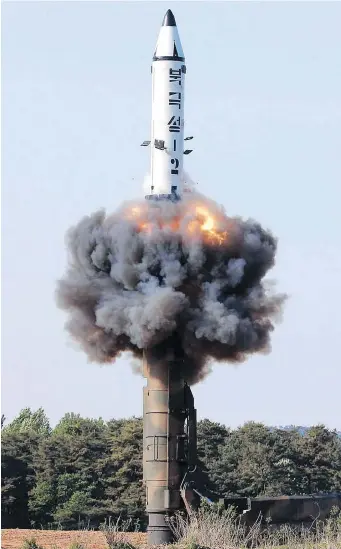  ?? KOREAN CENTRAL NEWS AGENCY / KOREA NEWS SERVICE VIA AP FILES ?? A solid-fuel Pukguksong-2 missile lifts off during its launch test in North Korea last May. Pyongyang is just as unwilling to give up its nuclear program as the U.S. is to let it keep its arsenal.