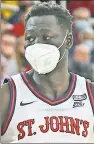  ?? Robert Sabo ?? PLAYING SAFE: St. John’s forward Esahia Nyiwe wears a mask during an 89-84 win Wednesday night.