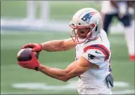  ?? Stephen Brashear / Associated Press ?? The Patriots’ Julian Edelman catches the ball during warmups before a Sept. 20 game against the Seahawks.