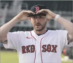  ?? AP PHOTO/STEVE HELBER ?? New Boston Red Sox shortstop Trevor Story adjusts his ball cap as he speaks to the media during a baseball press conference at JetBlue Park on Wednesday in Fort Myers, Fla.