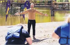  ?? URSULA COYOTE/USA NETWORK ?? Bob Harper, host of “The Biggest Loser,” talks to contestant­s. Production took place at Glorieta Adventure Camps, a self-contained site. A smaller model of production is being looked at for when film and TV shoots restart.