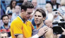  ?? ADAM HUNGER THE ASSOCIATED PRESS ?? Juan Martin del Potro, of Argentina, talks with Rafael Nadal, of Spain, after Nadal retired from the match during the semifinals of the U.S. Open tennis tournament on Friday.