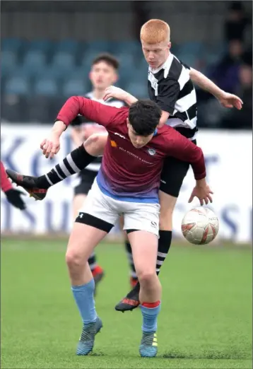  ??  ?? Shay Coleman of St Dominic’s under pressure from Quay Celtic’s Oisin McCumiskey.