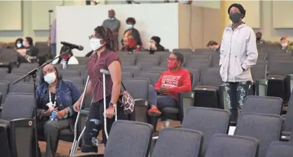  ?? MICHAEL SEARS / MILWAUKEE JOURNAL SENTINEL ?? Diamond Hartwell of Kenosha spoke on the need for more mental health services in a community the size of Kenosha than currently exist. Waiting to speak at right is Porche Bennett, who also presented the mayor with a letter detailing issues to be addressed. Kenosha residents spoke Sunday at the community listening session mediated by the U.S. Department of Justice as requested by Kenosha’s mayor. Other sessions are scheduled in the coming weeks. The session took place at Journey Church in Kenosha.