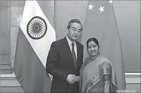  ??  ?? Chinese State Councilor and Foreign Minister Wang Yi (L) meets with Indian External Affairs Minister Sushma Swaraj. (Photo: Xinhua)