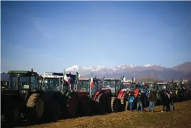  ?? ?? Italian farmers protest against EU agricultur­al policies, near Turin. Photo: Fabio Ferrari/LaPresse via AP