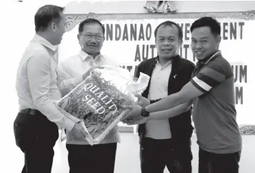  ??  ?? SECRETARY Emmanuel F. Piñol (second from left) leads the ceremonial turnover sorghum seeds to some provinces in Mindanao. The planting material is a donation from an American company. MinDA PHOTO