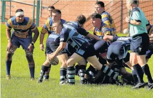  ??  ?? Llanhillet­h try scorer Dean Pitt spins the ball out from the base of the scrum