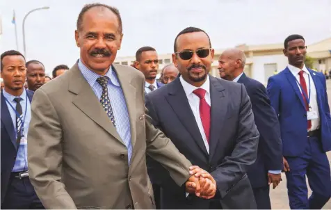  ?? Reuters ?? Eritrean President Isaias Afwerki and Ethiopia’s Prime Minister Abiy Ahmad at Asmara Internatio­nal Airport during the latter’s visit to Eritrea last week.