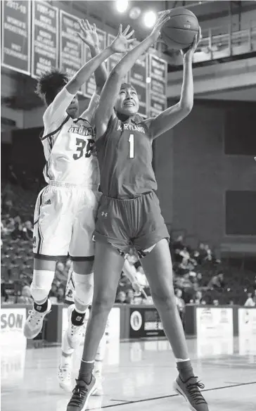  ?? LARENCE KESTERSON/ASSOCIATED PRESS ?? Maryland forward Shakira Austin, grabbing a rebound in front of Delaware guard Alison Lewis during a Terps victory in December, has won the Big Ten Freshman of the Week five times already this season.