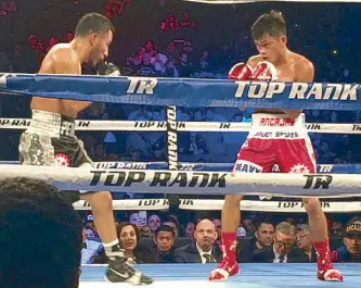  ??  ?? Ancajas and Santiago battle to a split 12-round draw.