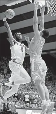  ?? AP/BRYNN ANDERSON ?? Alabama forward Donta Hall shoots over Tennessee forward Grant Williams during the Crimson Tide’s 78-50 victory over the No. 15 Volunteers on Saturday in Tuscaloosa, Ala. Hall had 17 points and 11 rebounds for the Crimson Tide.