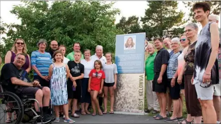  ?? BARB AGUIAR/Westside Weekly ?? Annette Beaudreau’s family and friends as well as Mayor Doug Findlater, councillor Rusty Ensign and City of West Kelowna staff pose with the plaque unveiled at the dedication ceremony for the Annette Beaudreau Amphitheat­re in Memorial Park at Music in...
