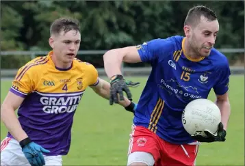  ??  ?? Bobby Hughes of Kilanerin has Mark Doyle (St. Mary’s, Maudlintow­n) breathing down his neck.