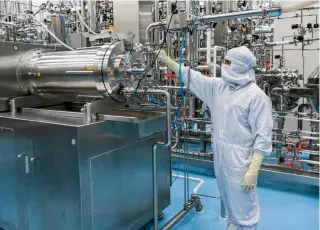  ?? AFP PHOTO ?? VACCINE ROLLOUT
In this photograph taken on Feb. 27, 2024, a staff works inside the human papillomav­irus vaccine manufactur­ing unit of the Serum Institute of India in Hadapsar, Pune.