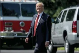  ?? ANDREW HARNIK — THE ASSOCIATED PRESS ?? President Donald Trump walks across the South Lawn of the White House in Washington, Tuesday to board Marine One for a short trip to Andrews Air Force Base, Md. and then onto Yuma, Ariz. to visit the U.S. border with Mexico and attend a rally in Phoenix.