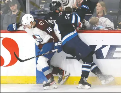  ?? KEVIN KING/WINNIPEG SUN ?? Colorado Avalanche forward Nicolas Aube-kubel (left) dodges a hit from Jets defenceman Dylan Samberg during Game 1 of their playoff series on Sunday.