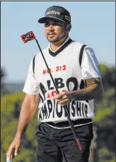  ?? The Associated Press George Walker IV ?? Australia’s Jason Day wearing his busy Malbon Golf Championsh­ip vest Friday.