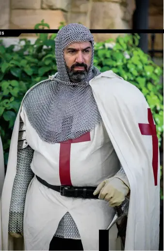  ?? Photograph­s by
Kristina Krug ?? Joseph A. Auteri, Grand Treasurer of the Temple of Jerusalem, prepares to induct new knights and dames into the order.