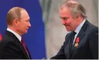  ?? — AFP ?? In this file photo Russian President Vladimir Putin (left) shakes hands with Mariinsky Theatreís Artistic Director, Valery Gergiev, during an awarding ceremony at the Kremlin in Moscow.