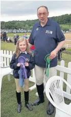  ??  ?? Elsie Johnstone and Paul Collett celebratin­g with their rosettes.