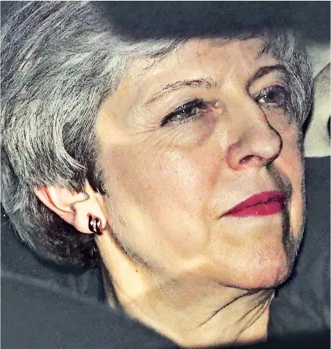  ??  ?? Theresa May being driven in her car from Parliament last night after telling Conservati­ve MPS she recognised the ‘mood’ of the party was for her to resign