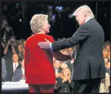  ??  ?? Hillary Clinton and Donald Trump shake hands during one of the debates