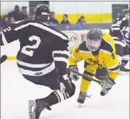  ?? Catherine Avalone / Hearst Connecticu­t Media ?? Xavier defenseman Luke Lappe, left, collides with Eddy Fracasso of Hamden in a Dec. 30, 2017 game in Hamden.