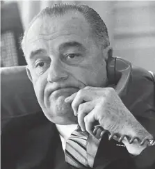  ?? LbJ LibrArY And ArCHiVES/Ap fLE ?? SPLIT RECORD: President Lyndon B. Johnson talks on the phone in this Jan. 10, 1964, White House photo. Johnson, like Biden, had some successes, such as the Civil Rights Act of 1964, the Voting Rights Act of 1965 and the establishm­ent of Medicare and Medicaid, but was hounded by criticism of his handling of the Vietnam War.