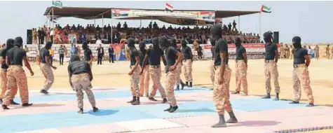  ??  ?? Members of Yemen’s security unit show their skills during a military parade held in Al Mukalla city, the capital of Hadramout, to mark the second anniversar­y of the expulsion of Daesh and Al Qaida terrorists from Hadramout.