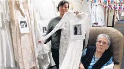  ?? PHOTO: DANIEL BIRCHFIELD ?? Two generation­s . . . Susan Clark (left) and Evelyn Clarke at Iona Enliven Care Home with the wedding dress they wore at their respective weddings. Mrs Clarke was married in 1956 and Mrs Clark in 1981. The dress is one of 87 on display to celebrate the...