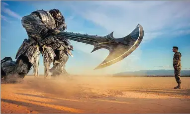  ?? PHOTOGRAPH: PARAMOUNT PICTURES ?? STAND-OFF: Megatron and Josh Duhamel in Transforme­rs: The Last Knight. It’s all an overstuffe­d mess, but that was true of the previous entries as well, and audiences obviously don’t seem to mind.