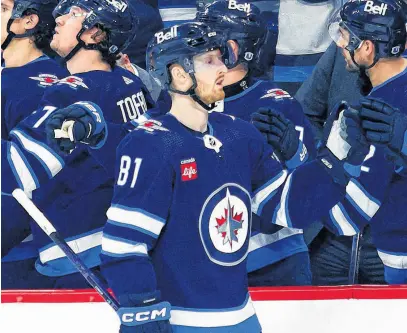  ?? USA TODAY SPORTS ?? Winnipeg Jets forward Kyle Connor (81) is congratula­ted by his teammates after a goal against the Seattle Kraken during the first period at Canada Life Centre, April 16.