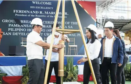  ?? ?? President Ferdinand R. Marcos Jr. leads the groundbrea­king ceremony of a Redevelopm­ent and Urban Renewal Project in Barangay Batasan Hills, Quezon City under his flagship Pambansang Pabahay para sa Pilipino Housing (4PH) Program. In attendance were House Speaker Martin Romualdez, Ilocos Norte Rep. Sandro Marcos, Quezon City Rep. Ralph Tulfo, DHSUD Secretary Jose Rizalino Acuzar, Mayor Joy Belmonte and other key government officials.