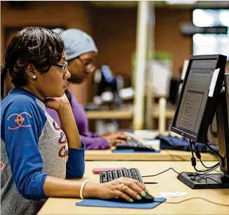  ?? AJC 2017 ?? Students work on computers at Clayton State University. Dr. T. Ramon Stuart, the university’s new president, is stressing the importance of STEM education, especially for minority students.