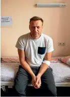  ?? AP ?? A handout photo released by navalny.com shows Alexei Navalny, Russia’s most prominent opposition figure, sitting on a bed in a hospital, in Moscow.