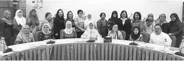  ??  ?? Fatimah (seated centre) with Empiang (seated third right) and others after the state MPWK meeting at Wisma Wanita, Semariang yesterday.