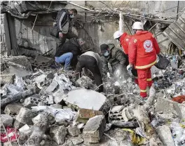  ?? MOHAMMED ZAATARI / AP ?? Paramedic workers search for victims in the rubble of a paramedic center that was destroyed by an Israeli airstrike early Wednesday in Hebbariye village, south Lebanon, on Wednesday. The strike was one of the deadliest single attacks since violence erupted on the Lebanon-Israel border more than five months ago.
