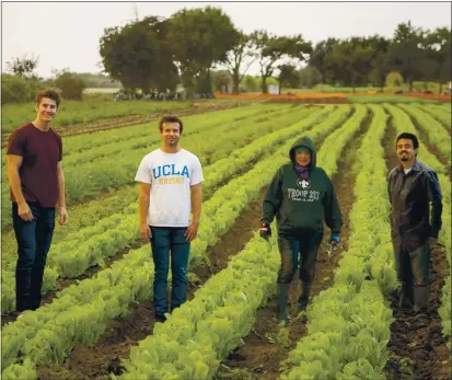  ?? COURTESY PHOTO ?? Los Gatans Chris Clark, left, and Jonathan Friedland, second from left, stand with farmers at ALBA Farms in Salinas. The Los Gatos High classmates source produce from the 100-acre training facility for Locale, their customizab­le delivery service that curates and delivers specialty items from high-quality local farms and small businesses.