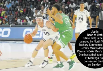  ??  ?? Justin
Bean of Utah
State (left) is being guarded by North Texas’s Zachary Simmonds in their Jersey Mike’s Jamaica Classic NCAA Men’s Division One basketball tournament at Montego Bay Convention Centre on Sunday.