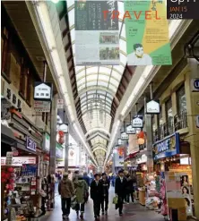  ?? ?? The covered arcade of Nishiki Market houses stalls selling traditiona­l goods and foods
