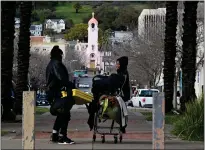  ?? ?? Shardae Barb, right, a worker with Community Action Marin, stops for a chat near the camp of homeless people at Albert Park.